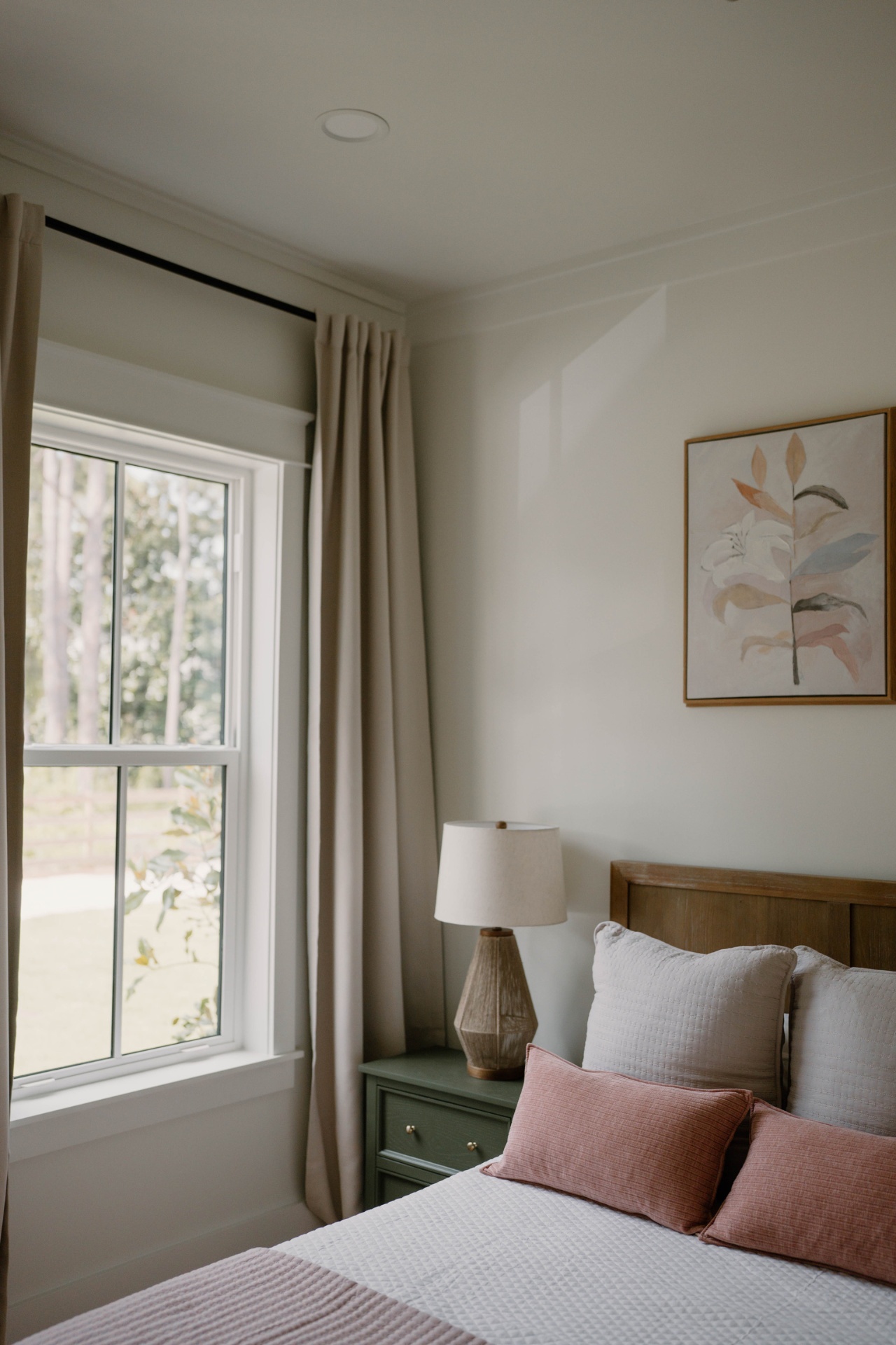 Guest bedroom with sage nightstand